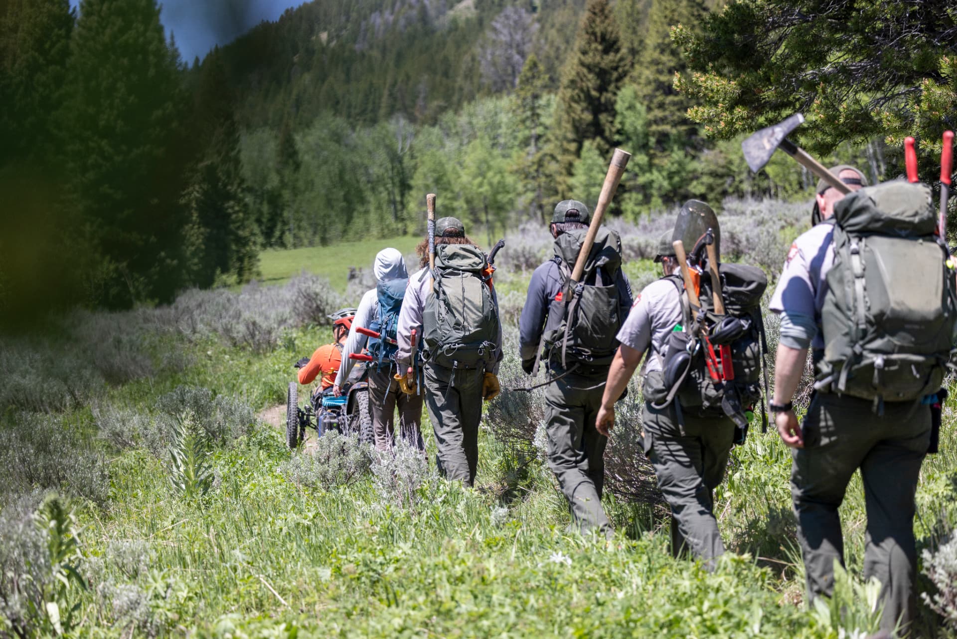 Grand Teton National Park trail crew walking into the backcountry with an adaptive rider