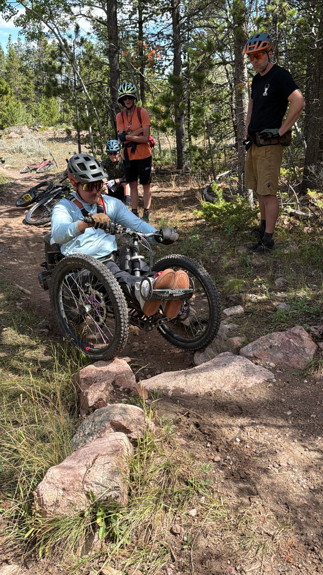 Adaptive rider on a Laramie-area trail with the Trail Fairies crew